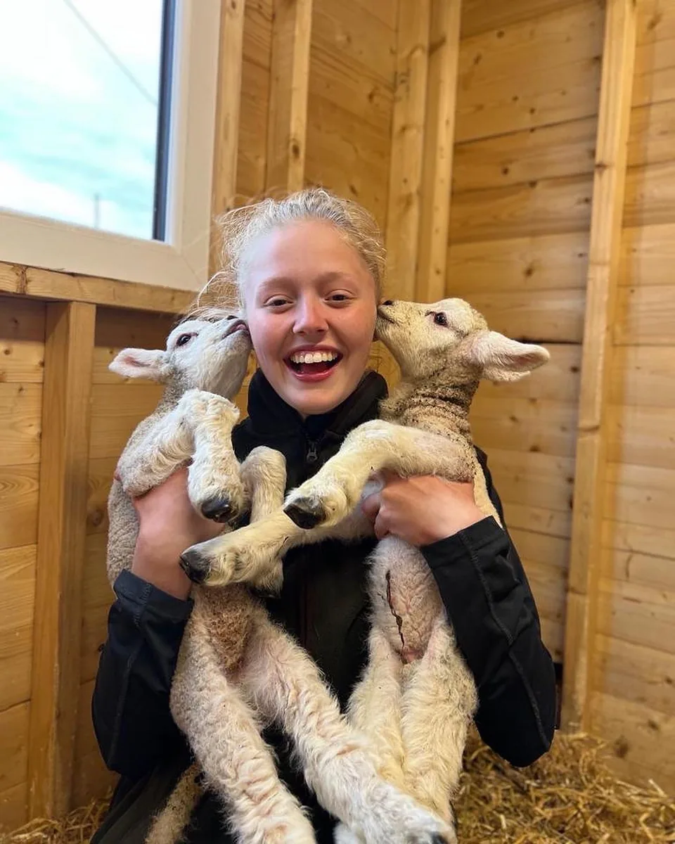 Emily caring for lambs at Emily's Mini Farm